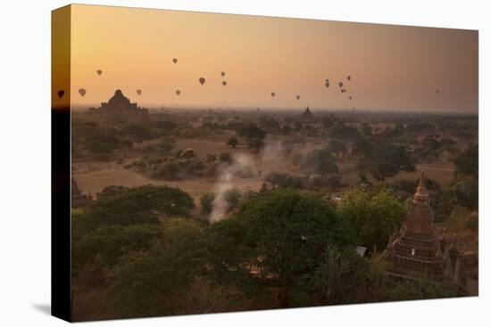 Hot Air Balloons at Sunrise Above Bagan (Pagan), Myanmar (Burma), Asia-Colin Brynn-Stretched Canvas