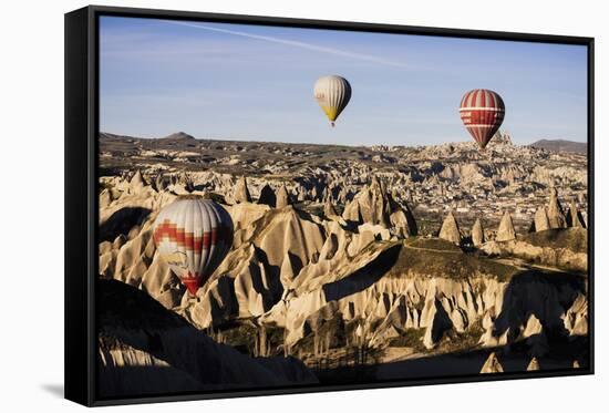 Hot Air Balloons Flying Among Rock Formations at Sunrise in the Red Valley-Ben Pipe-Framed Stretched Canvas