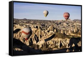 Hot Air Balloons Flying Among Rock Formations at Sunrise in the Red Valley-Ben Pipe-Framed Stretched Canvas