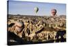 Hot Air Balloons Flying Among Rock Formations at Sunrise in the Red Valley-Ben Pipe-Stretched Canvas