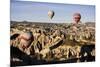 Hot Air Balloons Flying Among Rock Formations at Sunrise in the Red Valley-Ben Pipe-Mounted Photographic Print