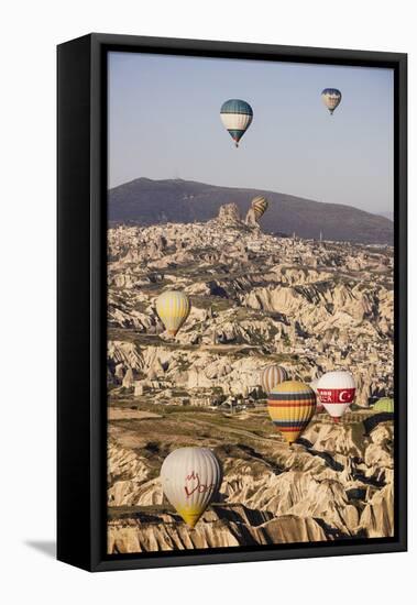 Hot Air Balloons Flying Among Rock Formations at Sunrise in the Red Valley-Ben Pipe-Framed Stretched Canvas