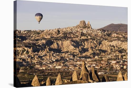 Hot Air Balloons Flying Among Rock Formations at Sunrise in the Red Valley-Ben Pipe-Stretched Canvas