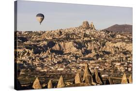Hot Air Balloons Flying Among Rock Formations at Sunrise in the Red Valley-Ben Pipe-Stretched Canvas
