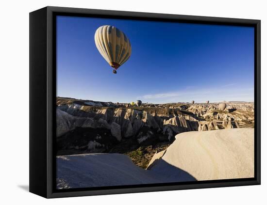 Hot Air Balloons Flying Among Rock Formations at Sunrise in the Red Valley-Ben Pipe-Framed Stretched Canvas