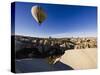 Hot Air Balloons Flying Among Rock Formations at Sunrise in the Red Valley-Ben Pipe-Stretched Canvas