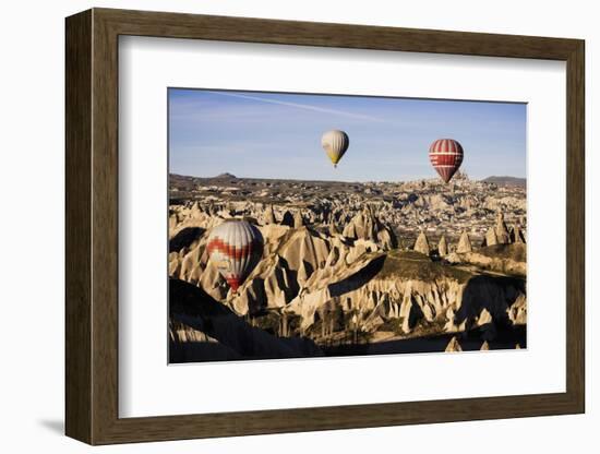 Hot Air Balloons Flying Among Rock Formations at Sunrise in the Red Valley-Ben Pipe-Framed Photographic Print