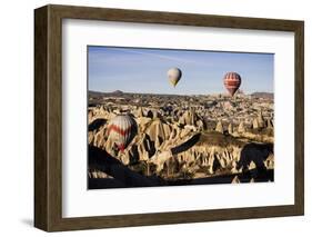 Hot Air Balloons Flying Among Rock Formations at Sunrise in the Red Valley-Ben Pipe-Framed Photographic Print