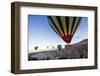 Hot Air Balloons Flying Among Rock Formations at Sunrise in the Red Valley-Ben Pipe-Framed Photographic Print