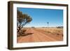 Hot Dusty Road across Flat Landscape with Water Vane-Will Wilkinson-Framed Photographic Print