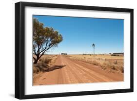 Hot Dusty Road across Flat Landscape with Water Vane-Will Wilkinson-Framed Photographic Print