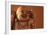 Hotei or the Laughing Buddha is a Wooden Statue on a Brown Background..-null-Framed Photographic Print