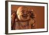 Hotei or the Laughing Buddha is a Wooden Statue on a Brown Background..-null-Framed Photographic Print