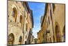 Hotel and bars on Medieval street, San Gimignano, Tuscany, Italy.-William Perry-Mounted Photographic Print