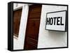 Hotel Sign on a Wall Near a Door-null-Framed Stretched Canvas