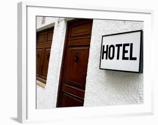 Hotel Sign on a Wall Near a Door-null-Framed Photographic Print