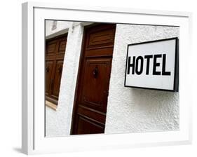 Hotel Sign on a Wall Near a Door-null-Framed Photographic Print