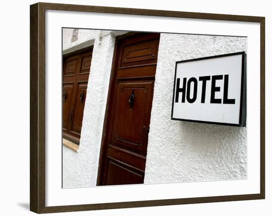 Hotel Sign on a Wall Near a Door-null-Framed Photographic Print