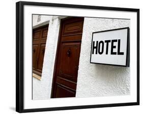 Hotel Sign on a Wall Near a Door-null-Framed Photographic Print