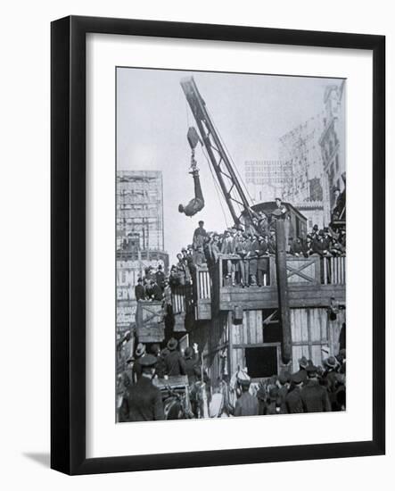 Houdini Escaping from a Strait-jacket While Suspended from a Crane in New York City-null-Framed Giclee Print