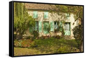 House with typical regional green shutters in the Marais Poitevin (Green Venice) wetlands, Arcais, -Robert Francis-Framed Stretched Canvas