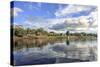 Houses along a riverbank in the Amazon basin, Peru.-Tom Norring-Stretched Canvas