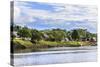 Houses along a riverbank in the Amazon basin, Peru.-Tom Norring-Stretched Canvas