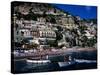 Houses Terraced into Rugged Amalfi Coastline, Boats in Foreground, Positano, Italy-Dallas Stribley-Stretched Canvas