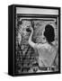 Housewife Cleaning Glass Window Slats-Gordon Parks-Framed Stretched Canvas