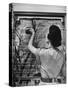 Housewife Cleaning Glass Window Slats-Gordon Parks-Stretched Canvas