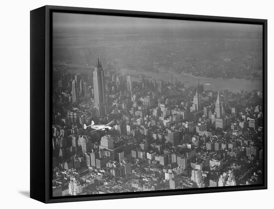 Howard Hughes Lockheed 14 Super Electra over New York City-null-Framed Stretched Canvas