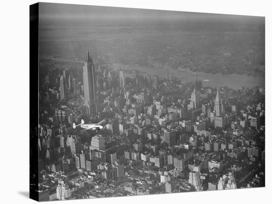 Howard Hughes Lockheed 14 Super Electra over New York City-null-Stretched Canvas