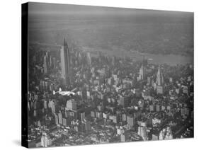 Howard Hughes Lockheed 14 Super Electra over New York City-null-Stretched Canvas