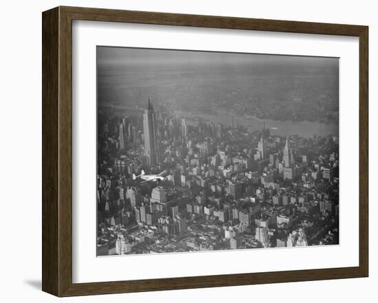 Howard Hughes Lockheed 14 Super Electra over New York City-null-Framed Photographic Print