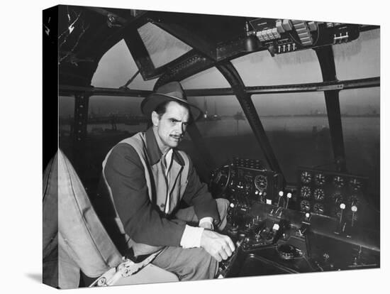 Howard Hughes Sitting at the Controls of His 200 Ton Flying Boat Called the "Spruce Goose"-J^ R^ Eyerman-Stretched Canvas