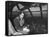 Howard Hughes Sitting at the Controls of His 200 Ton Flying Boat Called the "Spruce Goose"-J^ R^ Eyerman-Framed Stretched Canvas