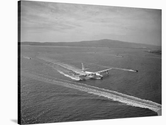 Howard Hughes' Spruce Goose Taxiing across Water-null-Stretched Canvas