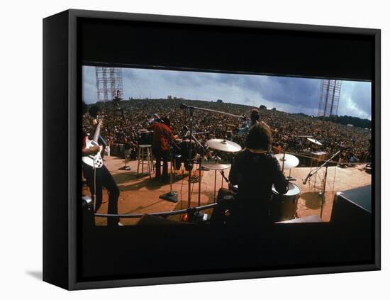 Huge Crowd Listening to a Band Onstage at the Woodstock Music and Art Festival-Bill Eppridge-Framed Stretched Canvas