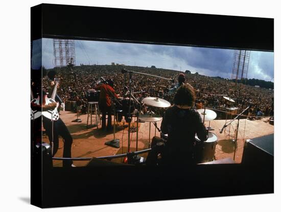 Huge Crowd Listening to a Band Onstage at the Woodstock Music and Art Festival-Bill Eppridge-Stretched Canvas