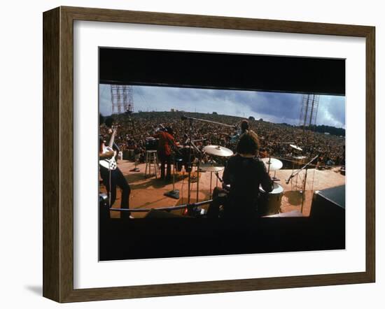 Huge Crowd Listening to a Band Onstage at the Woodstock Music and Art Festival-Bill Eppridge-Framed Premium Photographic Print