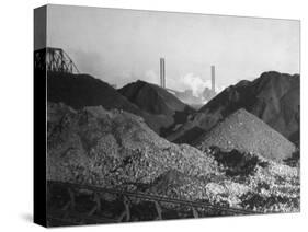 Huge Heaps of Iron Ore Outside Steel Plant, Brought in by Shipping Along the Great Lakes-Margaret Bourke-White-Stretched Canvas