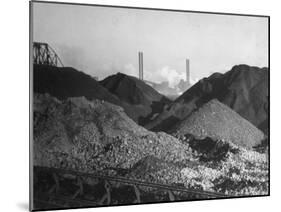 Huge Heaps of Iron Ore Outside Steel Plant, Brought in by Shipping Along the Great Lakes-Margaret Bourke-White-Mounted Photographic Print