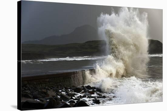 Huge Waves Crash Against a Stone Jetty at Criccieth, Gwynedd, Wales, United Kingdom, Europe-Graham Lawrence-Stretched Canvas