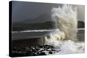 Huge Waves Crash Against a Stone Jetty at Criccieth, Gwynedd, Wales, United Kingdom, Europe-Graham Lawrence-Stretched Canvas