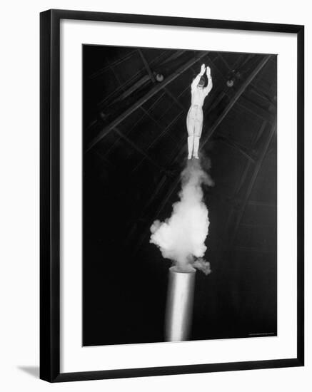 Human Cannonball Egle Zacchini Emerging From Barrel of Cannon During Her Circus Act-Cornell Capa-Framed Photographic Print
