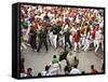 Hundreds Look at a Bull That Gored a Reveler During the Running of the Bulls at San Fermin Fiestas -null-Framed Stretched Canvas