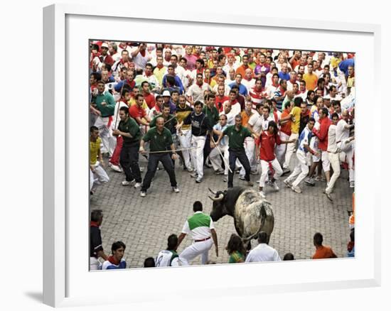 Hundreds Look at a Bull That Gored a Reveler During the Running of the Bulls at San Fermin Fiestas -null-Framed Photographic Print