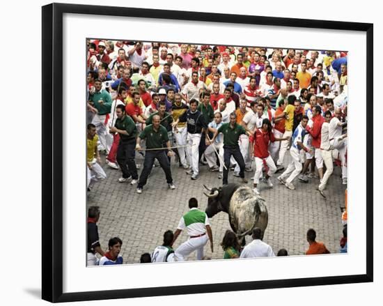 Hundreds Look at a Bull That Gored a Reveler During the Running of the Bulls at San Fermin Fiestas -null-Framed Photographic Print