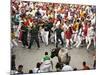 Hundreds Look at a Bull That Gored a Reveler During the Running of the Bulls at San Fermin Fiestas -null-Mounted Photographic Print