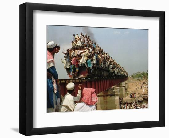 Hundreds of Muslim Pilgrims Ride on a Train Passing on a Bridge at Gazipur-null-Framed Photographic Print